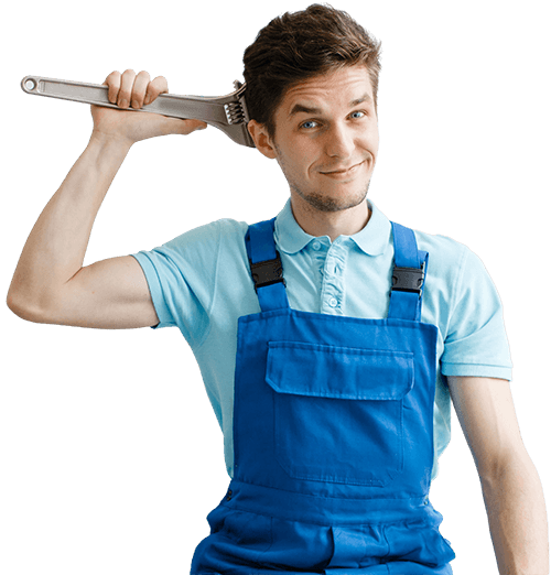 A male plumber in blue overalls standing and holding a massive wrench behind his head