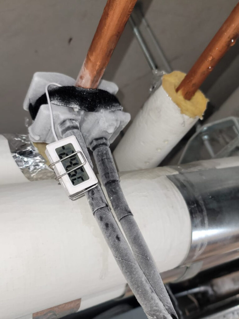 Close up of a thermostat that's included in our pipe freezing tool